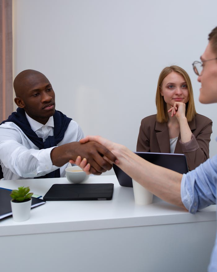 A diverse team in a professional meeting, symbolizing partnership and collaboration.